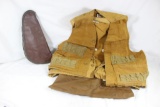 One zippered brown soft sided pistol case and one tan upland game bird vest. Used in fair condition.