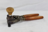 One wood handle bullet mold with wood knob. Used in good condition.