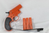 One Orion orange plastic flare gun with 3 flares. New.