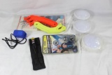 Bag of miscellaneous items. Three white plastic push-on lights, EdgeMaster knife sharpener, Etc.