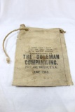 Old canvas coleman water bag with cork stopper. Used, but appears to be intact.