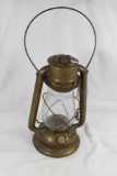 One C.T. Ham GEM brass kerosene lamp. Used, has a repair on the kerosene tank, but appears to be in