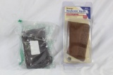 Two recoil pads. One slip on Decelerator pad, small, new in box and one leather lace on pad.