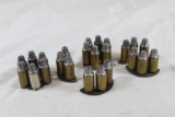 .45 ACP ammo in moon & half moon clips. 24 rounds. 3 half moon & 1 full moon clip inside plastic