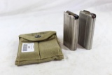 One US WWII green canvas double magazine pouch. Has two metal 30 Carbine magazines with ammo. Used.