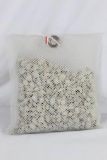 Nylon net bag of rock desiccant. Still white new.