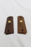 One set of wood checkered Colt 1911 grips. Like new.