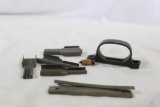 One trigger guard and six M-4 stripper housing and 2 stripper clips. Used.