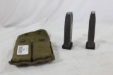 One US military green nylon double magazine pouch for M1 carbine mags. Has two KRD 9mm 12 round