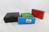Three assorted MTM plastic ammo boxes and one small Taurus pistol box. Used.