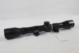 One Tasco 4x32 rifle scope with rail mount rings. Like new, no box.