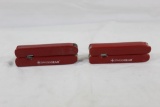 Two Red handled Swiss Army multi-function tools. Like new.