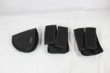 Two nylon double magazine pouches and one nylon Acorn velcro backed holster. In like new condition.