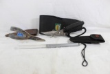 One Overland Fisherman's pliers in leather case, one Cabela's game shears in nylon case and Coast