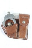 One Italian police leather handcuff and knife holder. Has handcuffs but no knife. In very good