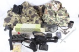 Box of miscellaneous hunting items. One childs camo coveralls, one child size camo insulated pants,
