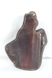 One DeSantis leather right handed FBI cant thumb holster for 45 ACP. Used in good condition.