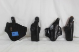 Two black leather right handed holsters for 1911, one 1911 nylon right handed holster and one black