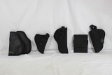 Two right handed nylon pistol holsters, one Ambi nylon holster and two leather ambi pocket holsters.