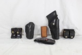 One right handed black leather holster, one behind the back black leather small pistol holster, two