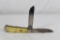 Large Moore Maker trapper with 3.75 inch blades. Smooth yellow bone scales. Main blade has liner