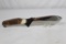 Puma German made new hunter with 6.5 inch skinning blade. Stag handle. Leather sheath. Appears as