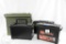 One large plastic empty ammo can and three smaller empty plastic ammo cans.