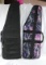 Two nylon soft sided, padded AR-15 rifle cases. One is black and one is pink and purple camo. Both