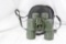 One pair of Bushnell green rubber coated 7x50 binoculars in case with eye and lens covers. Actually