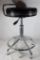 One steel leg padded seat stool. Used in good condition.