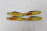 Four larger Coca-Cola advertising knives with 2.5 inch single blades.