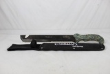Camillus machete with 11.5 inch partially serrated blade and cordura sheath. Appears as new.