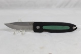 Single blade Buck folding liner lock hunter with 3.25 inch partially serrated blade. Black and green