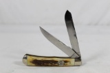 Moore Maker model 6202 trapper with 3.25 inch blades. Made in 2006. Amber stag scales. As new in