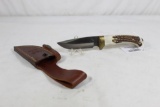 Hen & Rooster sheath knife with 4.0 inch blade, stag scales and leather sheath. Appears as new.