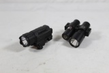 Two rail mount flashlights, One has a laser.