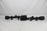 Two Bushnell rifle scopes. One Trophy-XLT BDC 3-9 x 40, has tape or scratches on the eye piece and