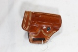 One brown leather Galco Rt handed belt holster for small auto. Like new condition.