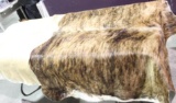 One Brindle cowhide size range 27-32 sq. ft. has a chunk cut out of it. One brown and white cowhide