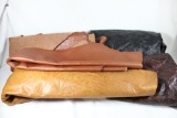 Large selection of leather hides and raw leather for craft work.