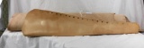 Unfinished leather rifle scabbard and roll of heavy duty leather.