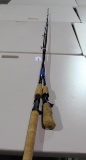 One Abu Garcia short handle 5 1/2' bait casting rod and one Shimano 6' baitcasting pitching rod.