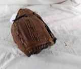 One Wilson leather Ultimate softball glove. Used in very good condition. Has softball in pocket.