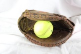 One Nokona leather softball catcher's glove. Used in very nice condition. Has one yellow Wilson