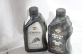 Two bottles of Harley Davidson oil, one 20W-50 motorcycle oil and Formula + Transmission and primary