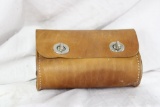 One brown leather ammo pouch with twist latch locks. Used in very nice condition.