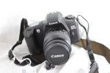 One Canon 35mm automatic camera with attached small tripod. Used.