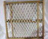 One wood framed child/pet door gate. Used. in working condition.