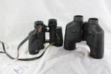Two pairs of binoculars. One Gibbson 8x30's and one Meade 7x35's. Used.