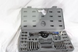One, what looks to be complete tap and die set in grey plastic box. Used.